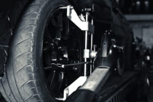 Car tires undergoing wheel alignment services