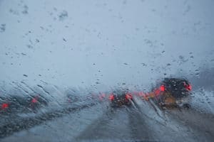 Wet and foggy window creates a winter visibility hazard