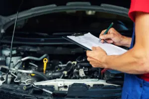 mechanic with maintenance checklist