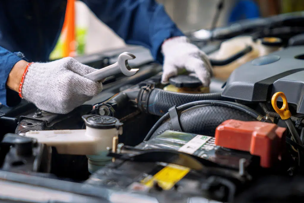 Auto mechanic working in the garage, Service and maintenance and car maintenance.