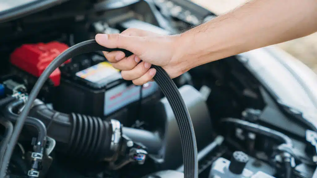 Young man checking and maintenance on his car. Car repair and maintenance concept.