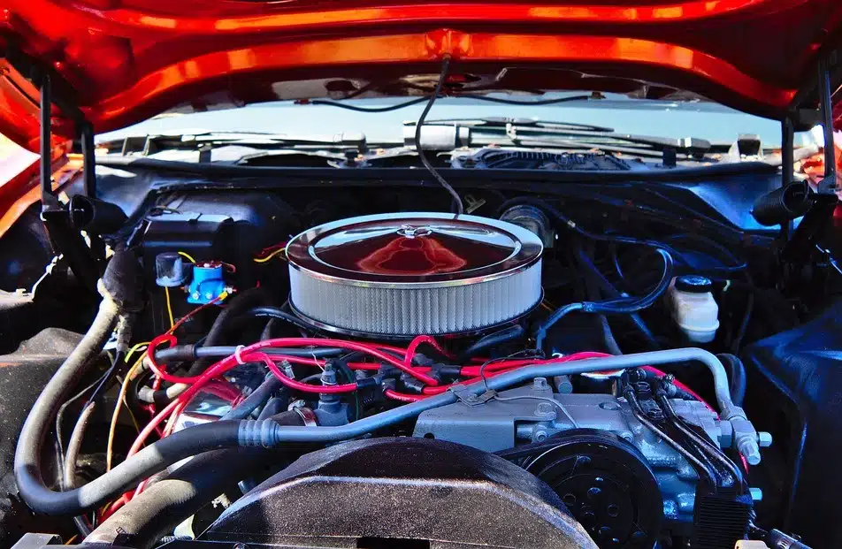 mechanic changing car air filter