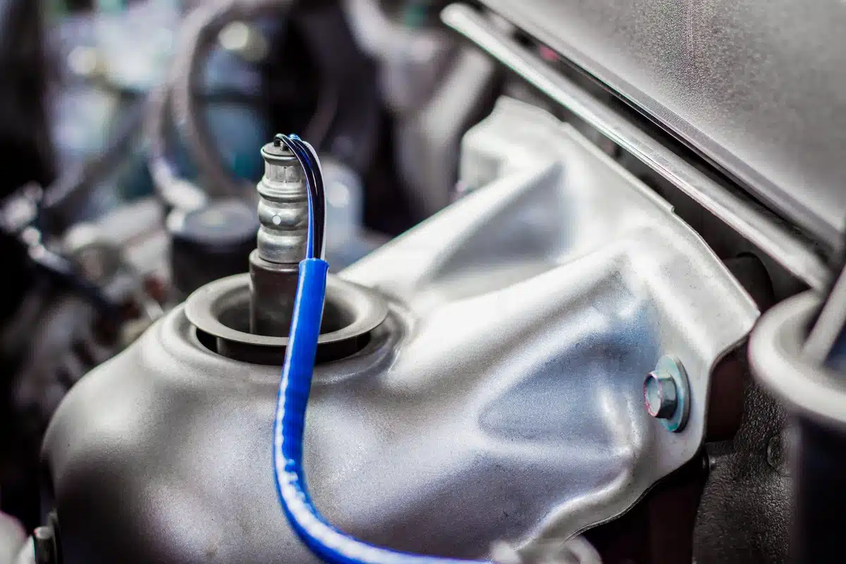 close up of oxygen sensor in vehicle